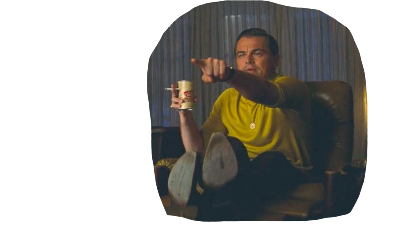Meme of Leonardo DiCaprio sitting on a chair, pointing at a TV screen while holding a beer and cigarette.